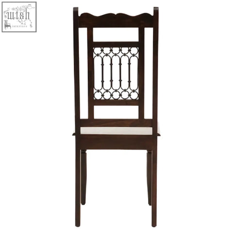 Dark sheesham wood dining chair with ornate metal back panel and upholstered seat for stylish wood dining seating