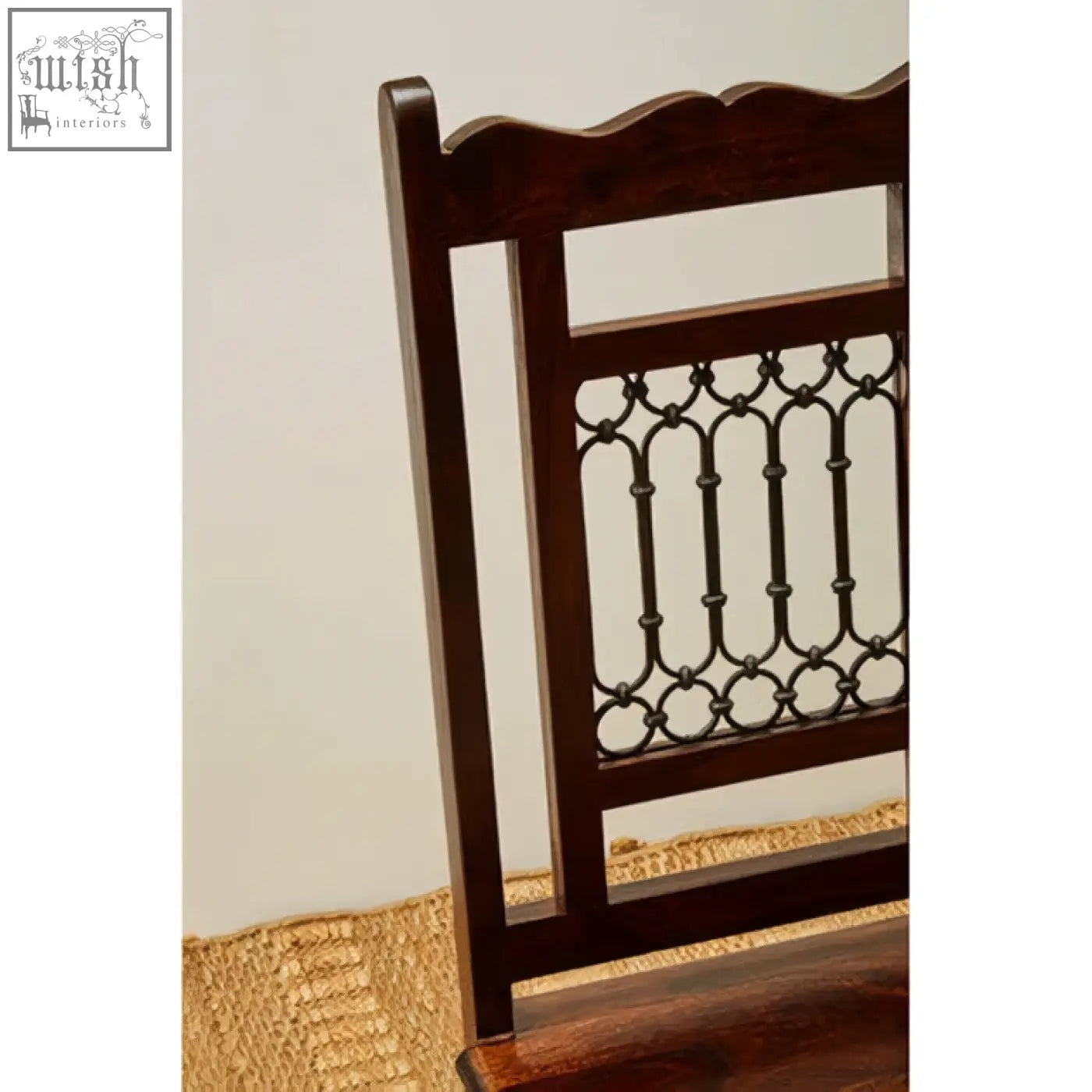 Back view of srina dark sheesham wood dining chair with dark wood frame and ornate metal lattice backrest