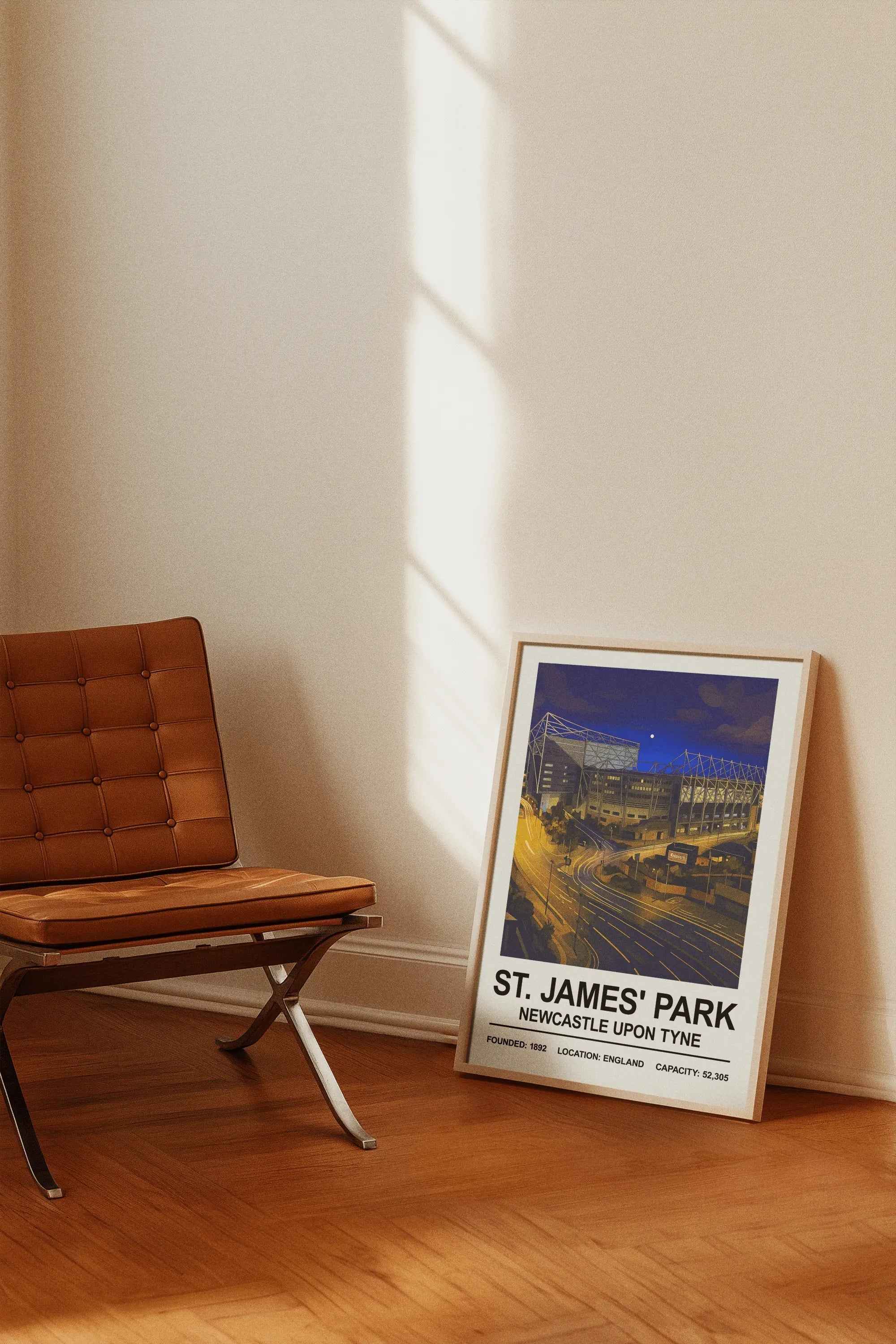 A framed stadium print of st james park night edition with dark blue tones perfect for sports fans room decor