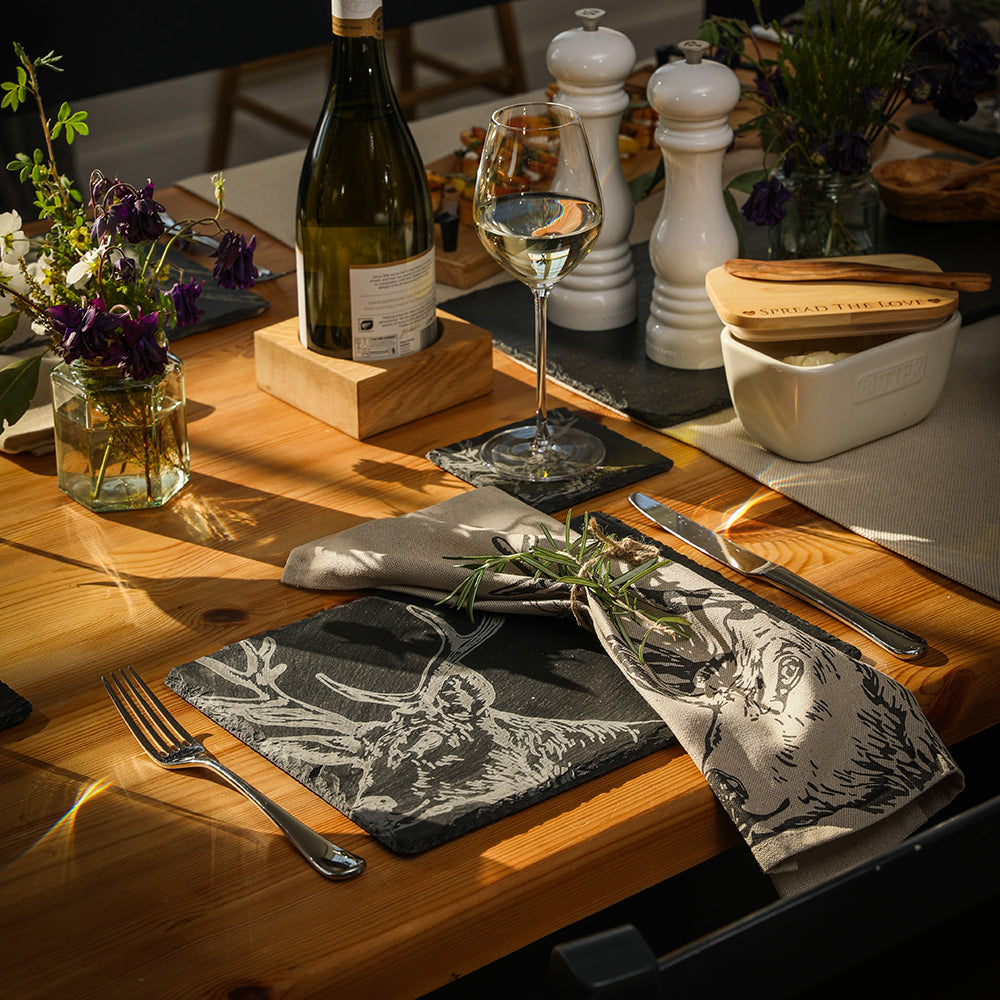 Black slate placemat with white engraved deer design paired with stag linen napkins set of 2