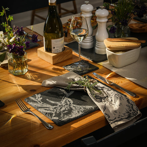 Black slate placemat with white engraved deer design paired with stag linen napkins set of 2