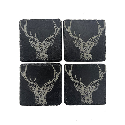 Set of four black slate coasters with detailed white etched stag head design perfect for stylish drink protection