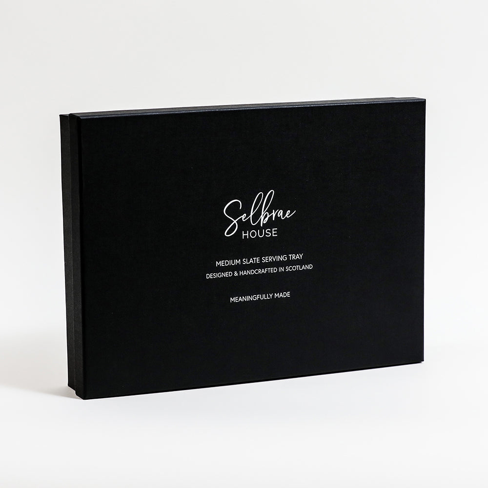 Black rectangular box with white selbrae house logo and text describing a medium slate serving tray for slate serving
