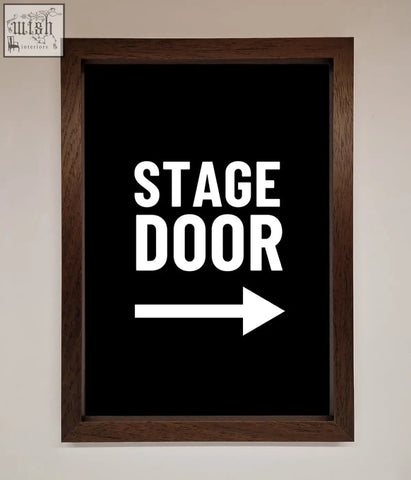 Black framed stage door framed print with bold white text and right pointing arrow for theater decor