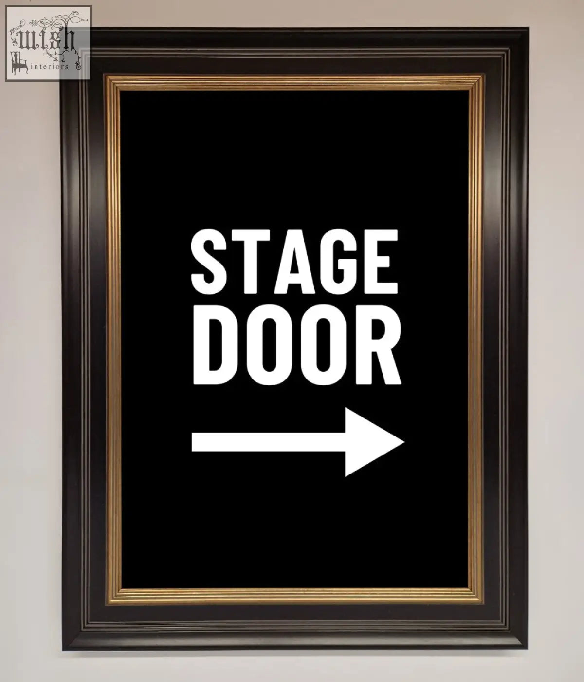 Stage door framed print featuring a black door framed print with bold white letters and gold inner border arrow