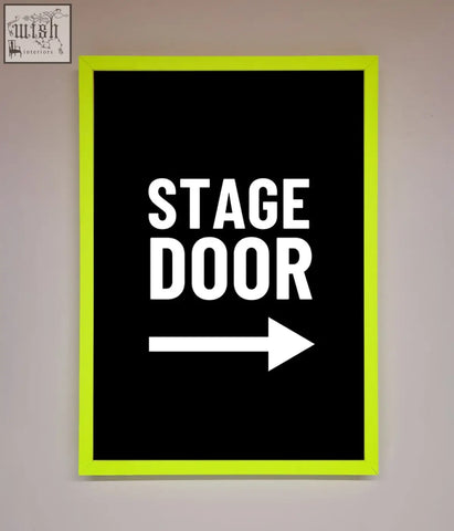 Neon green stage door framed print with bold white text on black background and a right pointing arrow sign