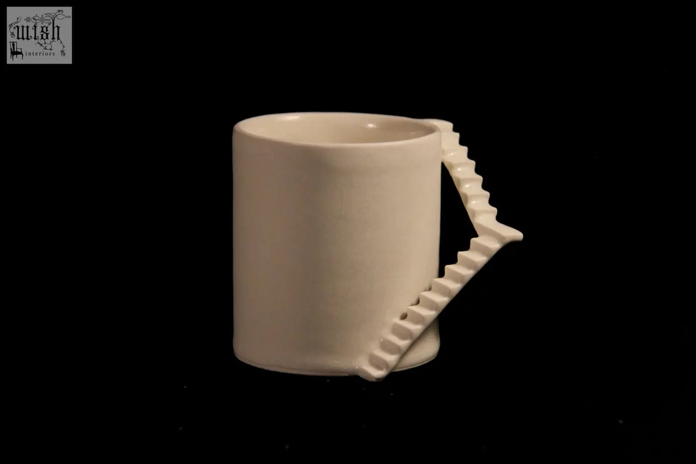 A white ceramic mug from the stairs series with a unique staircase handle by 4am product design