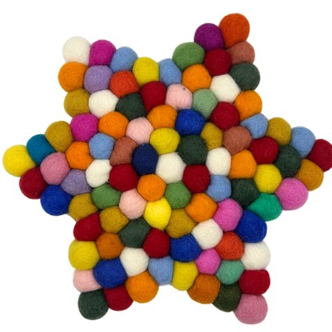 A star shape centre mat made of multicolour wool felt balls perfect for adding vibrant texture to your table