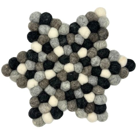 Star shape centre mat made of black gray and cream wool felt pom poms for decor and table use