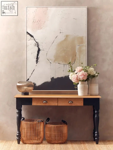 The steen large vase is a glazed stoneware large vase with a warm wood console table featuring navy legs and wicker baskets