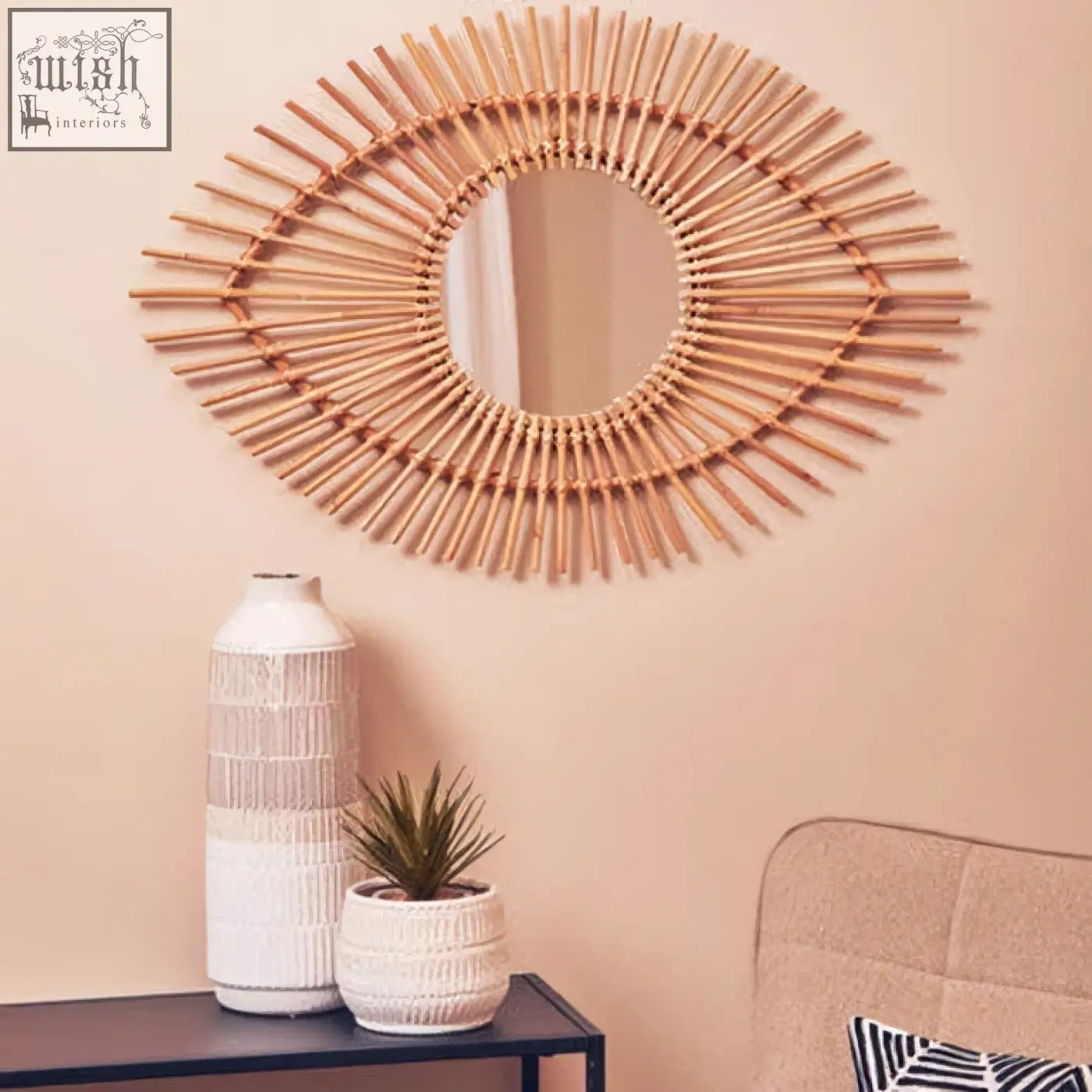 Rattan eye-shaped wall mirror with a natural beige finish and circular design beside steen large vase glazed stoneware