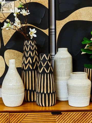 Set of five steen large vase black and white ceramic vases with geometric patterns on a wooden surface glazed stoneware