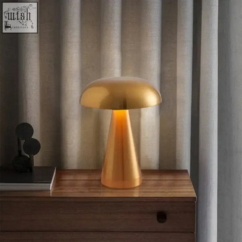 Golden mushroom shaped stella rechargeable table lamp with sleek metallic finish built in rechargeable battery led bulbs