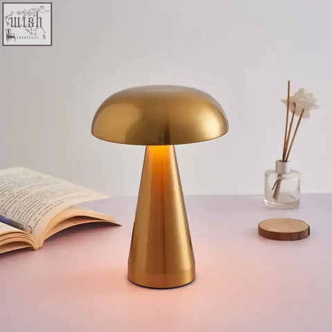 Golden mushroom-shaped stella table lamp with sleek metallic finish built-in rechargeable battery and led bulbs