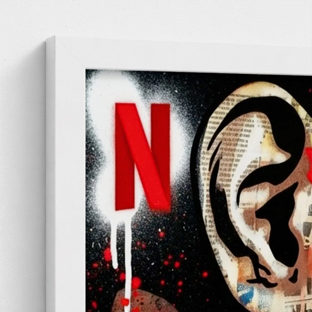A bold red netflix logo with spray painted drips and black graffiti on a newspaper print framed canvas