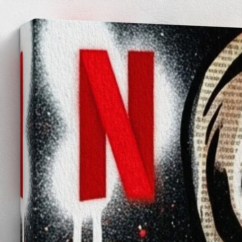 Bold red netflix logo spray-painted on textured canvas with black and white splatter on a framed canvas print