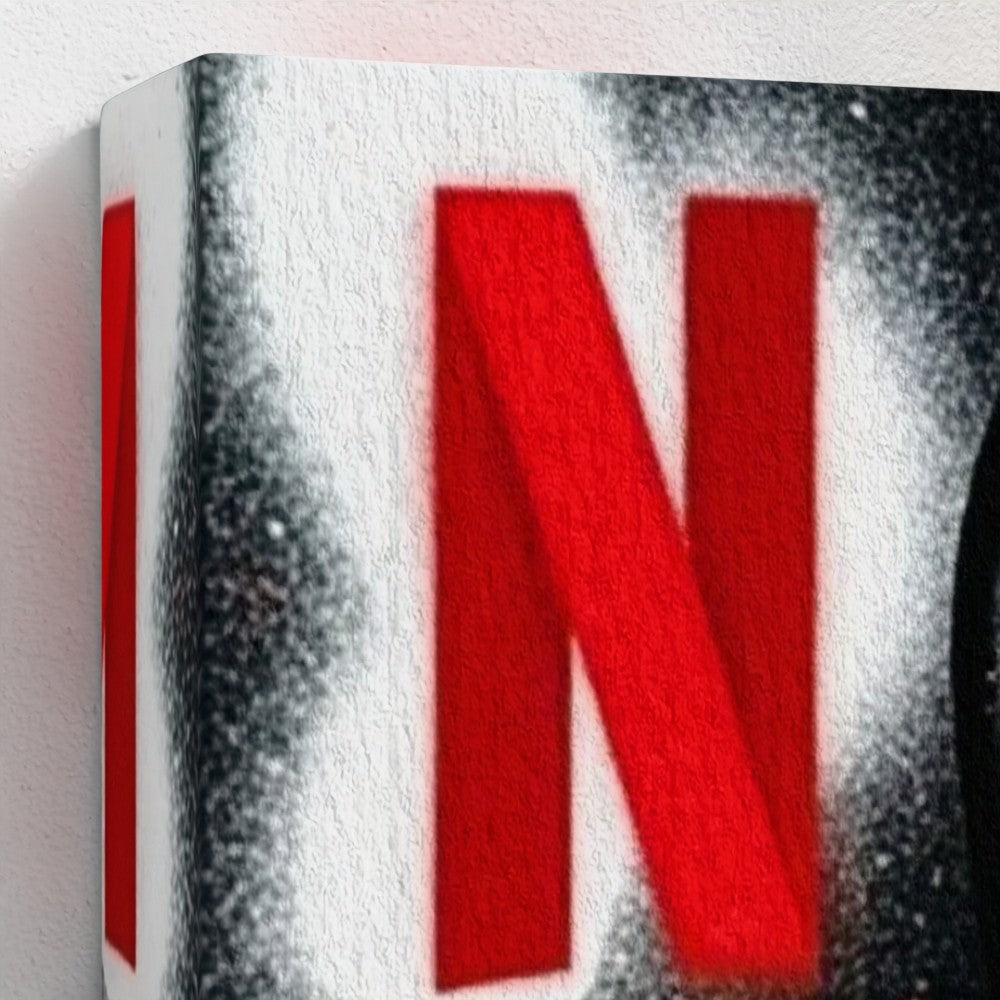 Red netflix logo spray-painted on textured white canvas in stencil state of mind framed canvas print