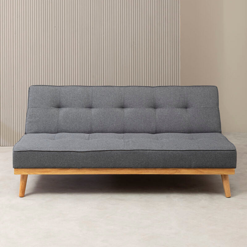 Grey sofa bed with tufted fabric and light wood legs perfect for a modern living room or guest space