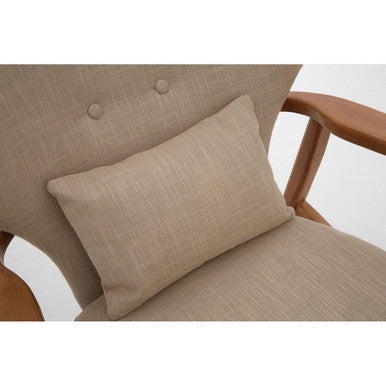 Beige linen textured rectangular pillow resting on a wooden armchair frame of the stockholm beige chair