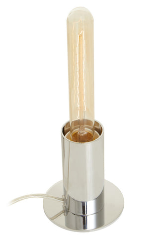 A stockholm chrome finish table lamp with sleek cylindrical design and amber vintage-style filament bulb