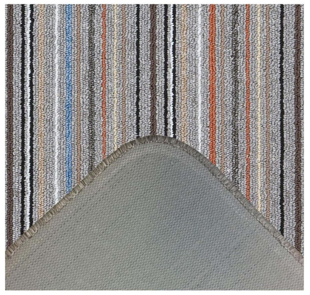 A stockholm grey clay washable mat with grey stripes and loop pile texture perfect for bathroom use
