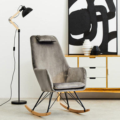 Grey velvet rocking chair with black metal legs and wooden rockers perfect for cozy seating