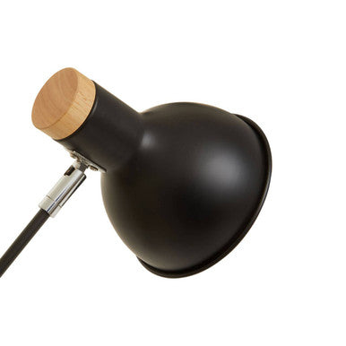 Stockholm matte black table lamp with a black matte finish and a circular wooden cap on the neck