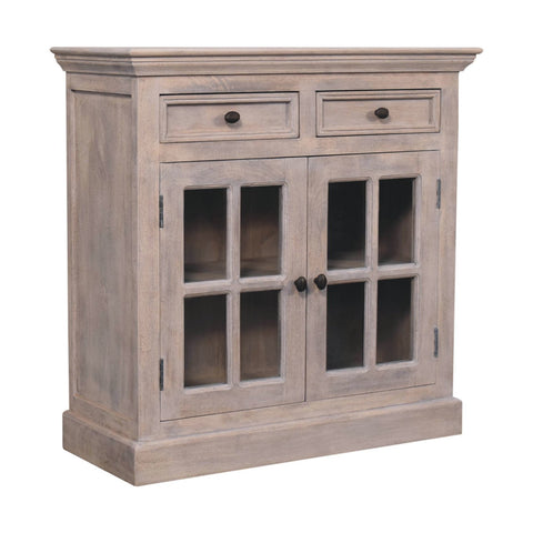 A rustic gray stone finish cabinet with glazed doors and two drawers featuring dark metal knobs