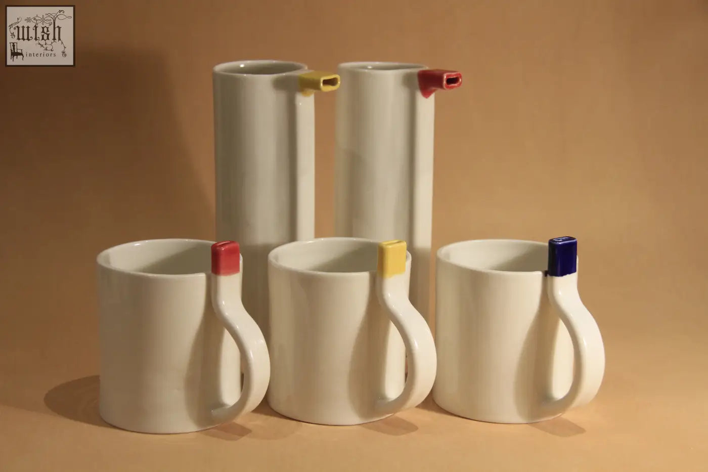 White ceramic straw cup mugs with colorful rectangular caps in red yellow and blue for easy sipping