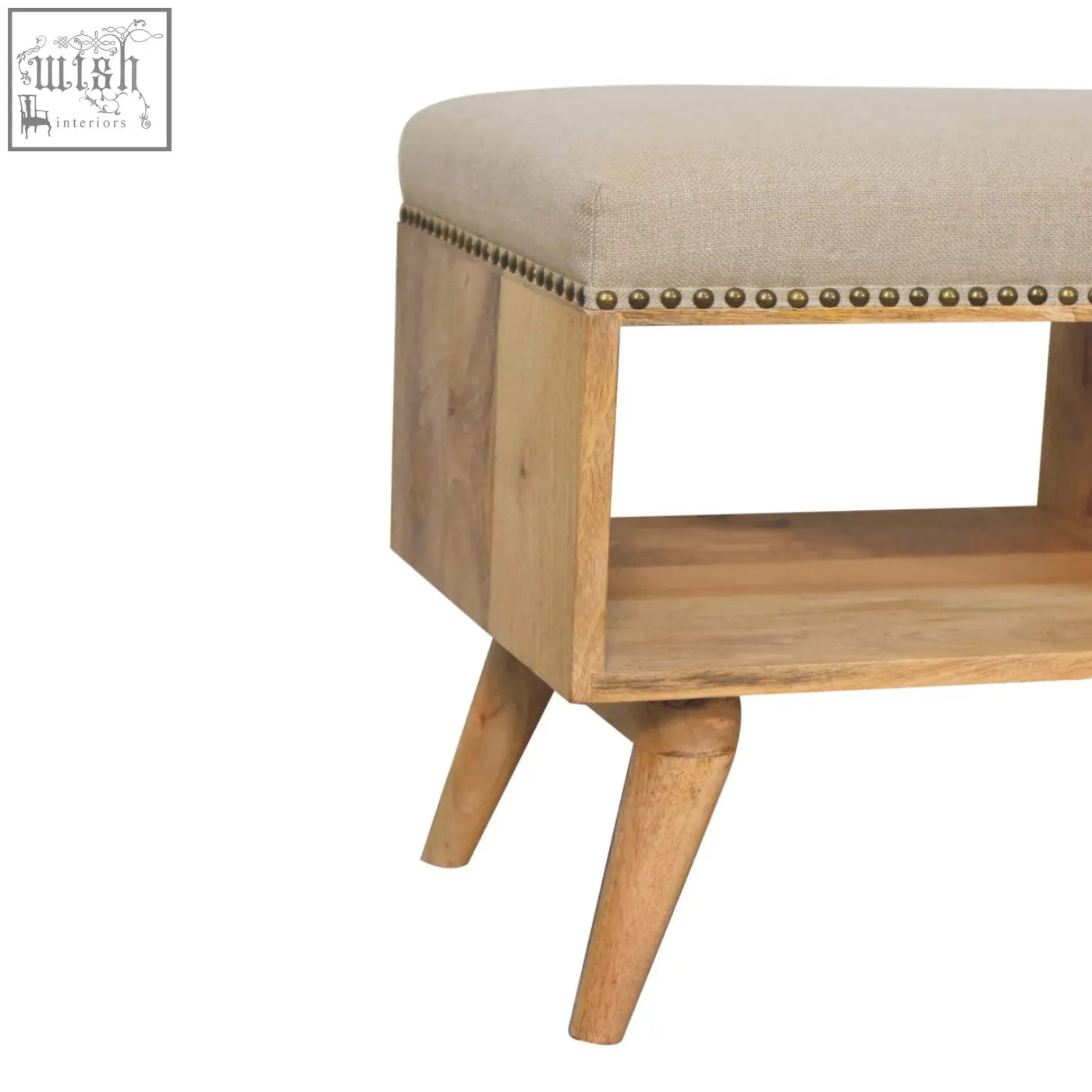 Beige upholstered studded linen open bench with solid mango wood tapered legs and brass nailhead trim