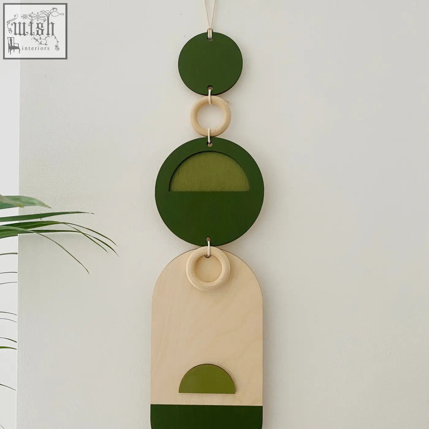 Stylish green geometric wall art wooden wall hanging with beige circular and arched shapes for modern decor