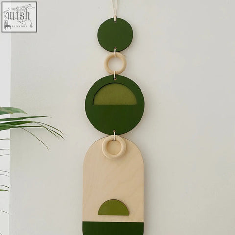 Stylish green geometric wall art wooden wall hanging with beige circular and arched shapes for modern decor