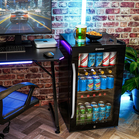 Black glass-door subcold ace100 beer fridge with led touch control and illuminated interior showing beer cans inside