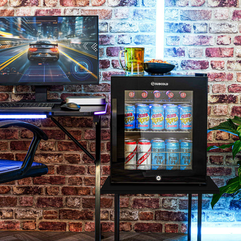 Black glass door subcold ace50 beer fridge with led touch control and illuminated interior showcasing cans of beer and soda