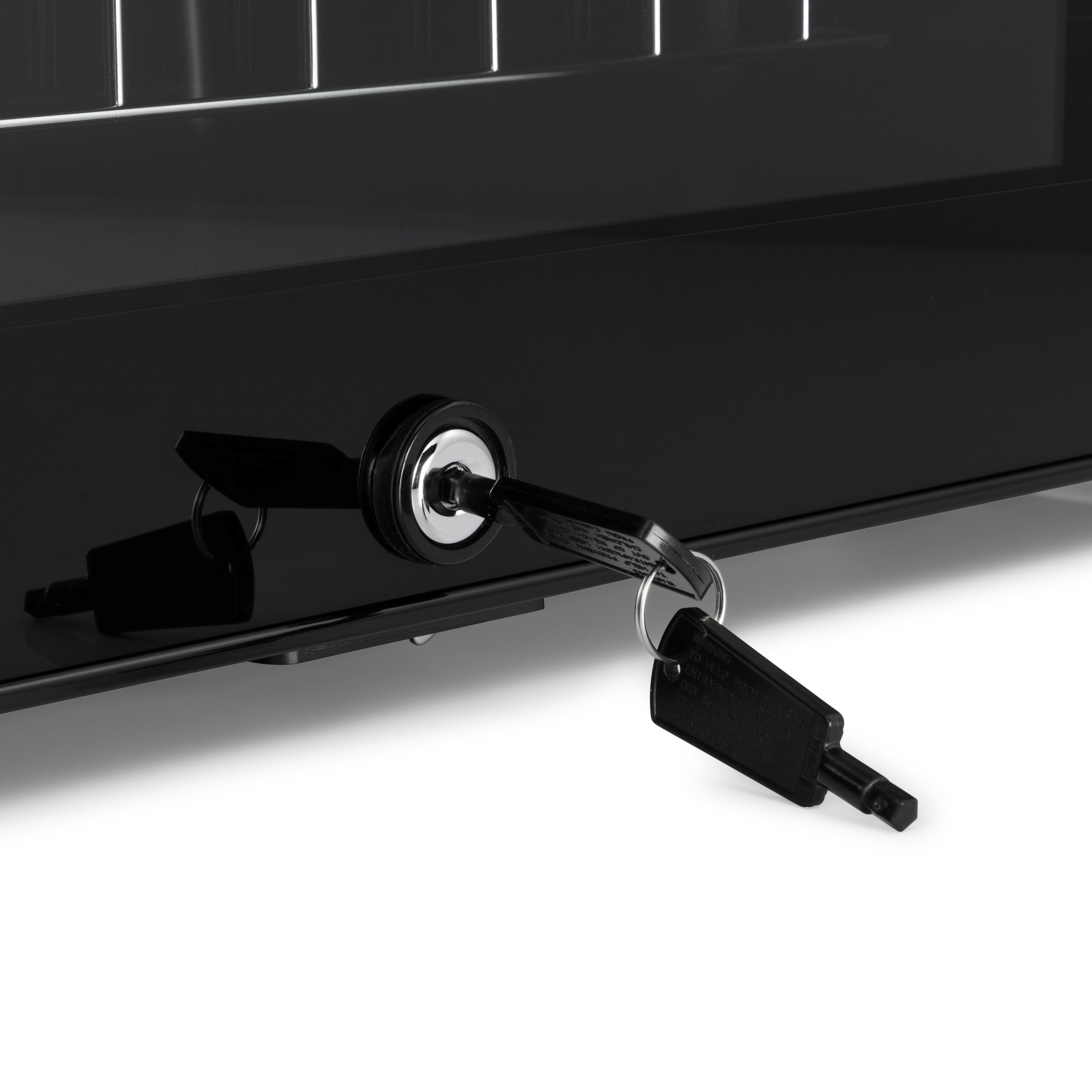 Black key inserted into glossy black lock on sleek subcold ace50 led touch control beer fridge door