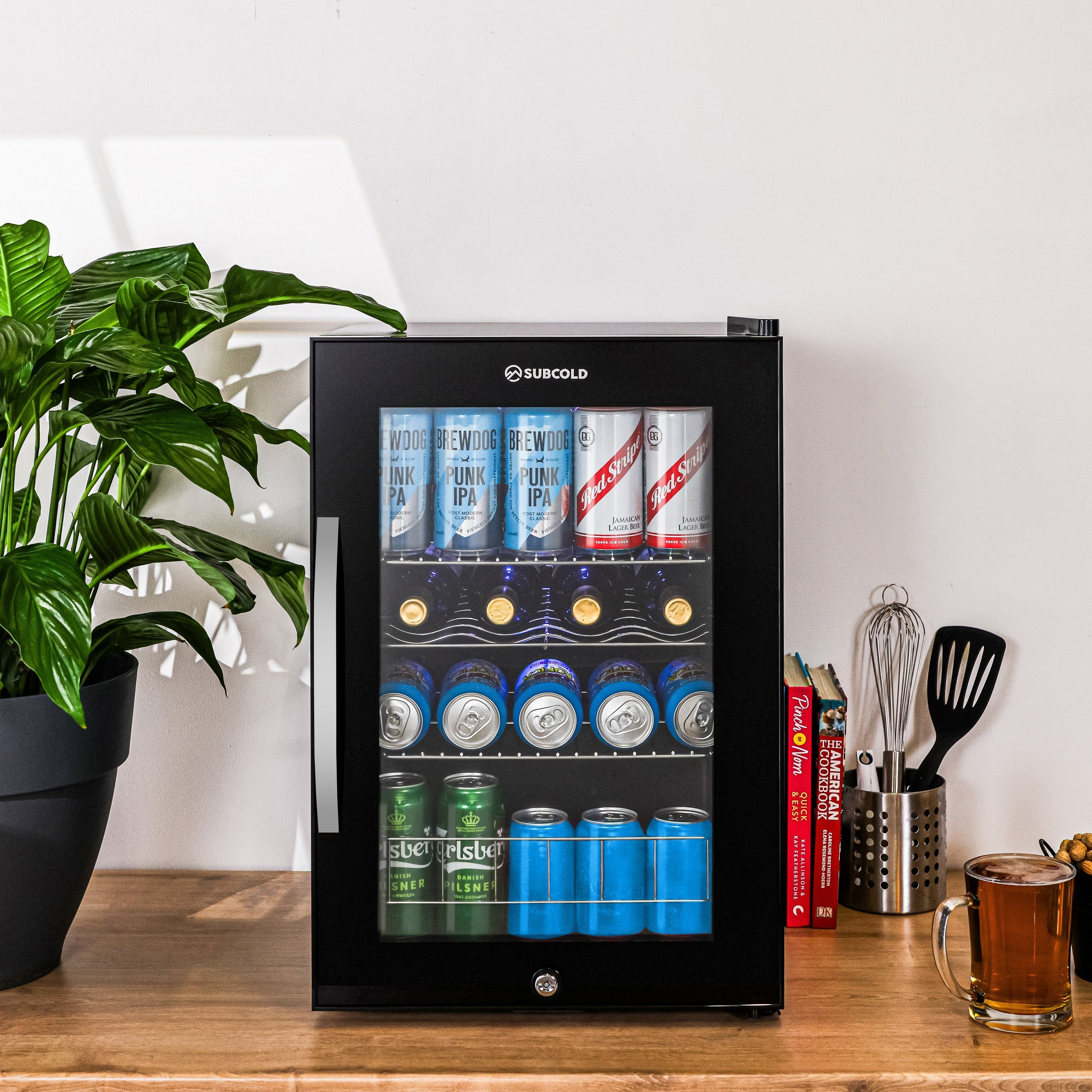 Black glass-door beer fridge with silver handle and subcold ace65 logo for chilled beverage storage
