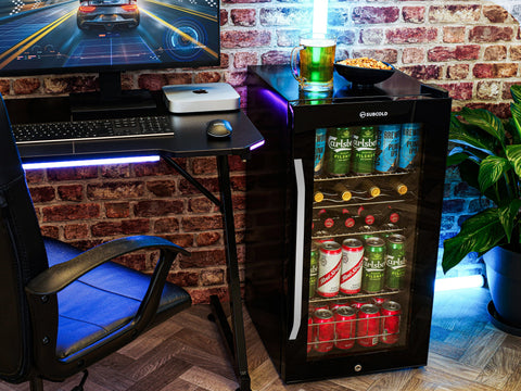Black subcold ace90 beer fridge with glass door, led touch control, and illuminated interior showing beer cans inside