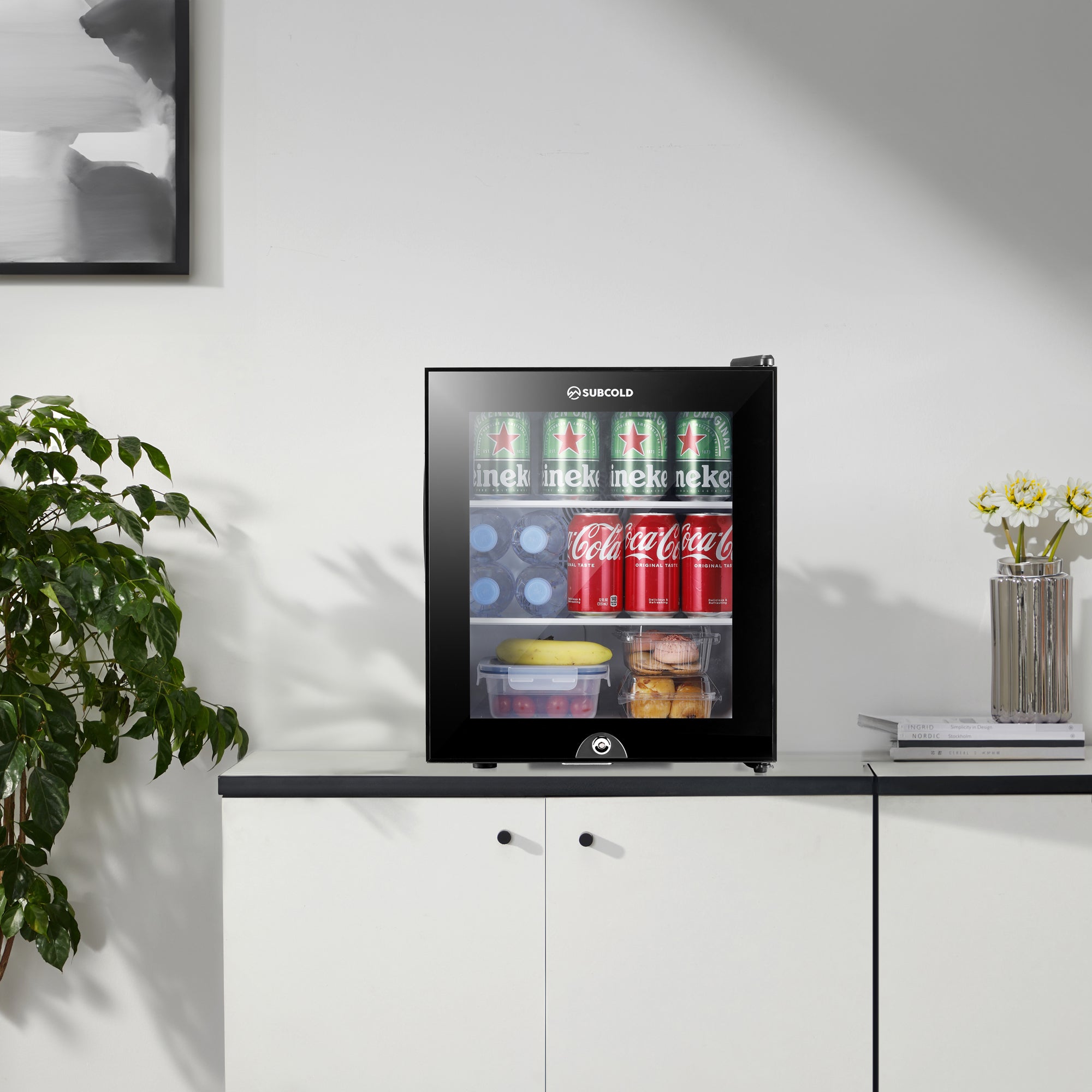 Black glass-door mini fridge with sleek modern design and subcold branding on top model aire30-g
