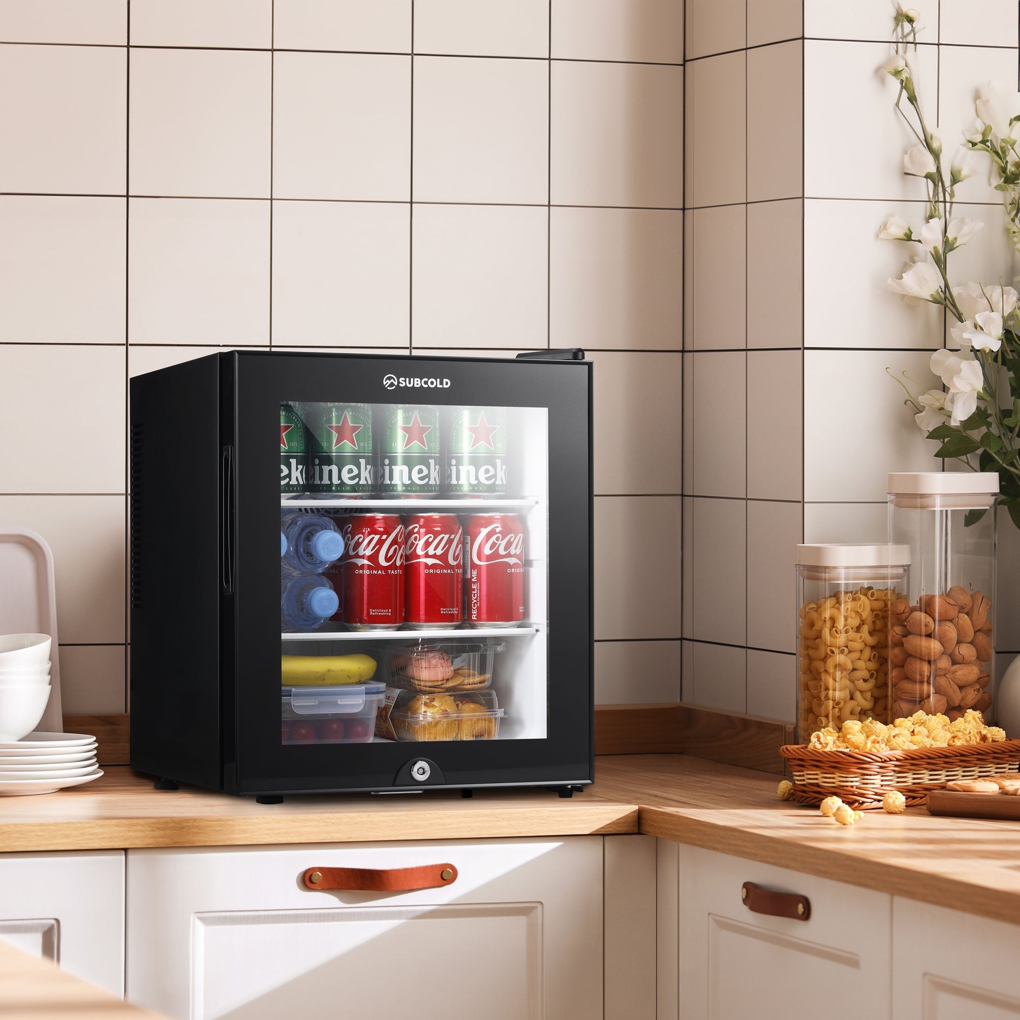 Black glass-door mini fridge subcold aire30-g with sleek modern design and subcold brand name on top