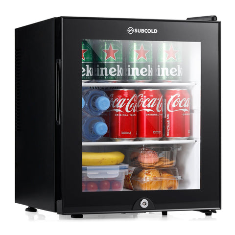 Black subcold aire30-g mini fridge with glass door and shelves stocked with drinks and snacks inside