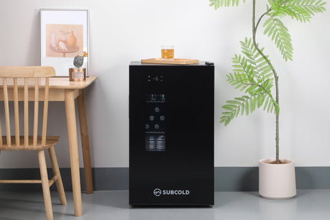 Black subcold apex95 mini beer fridge with glass door digital display and two cans inside