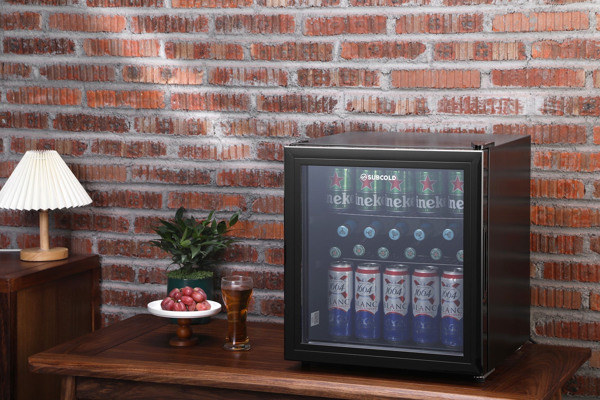 Black subcold cave50 glass door mini fridge with silver trim perfect for soft drinks and beer storage
