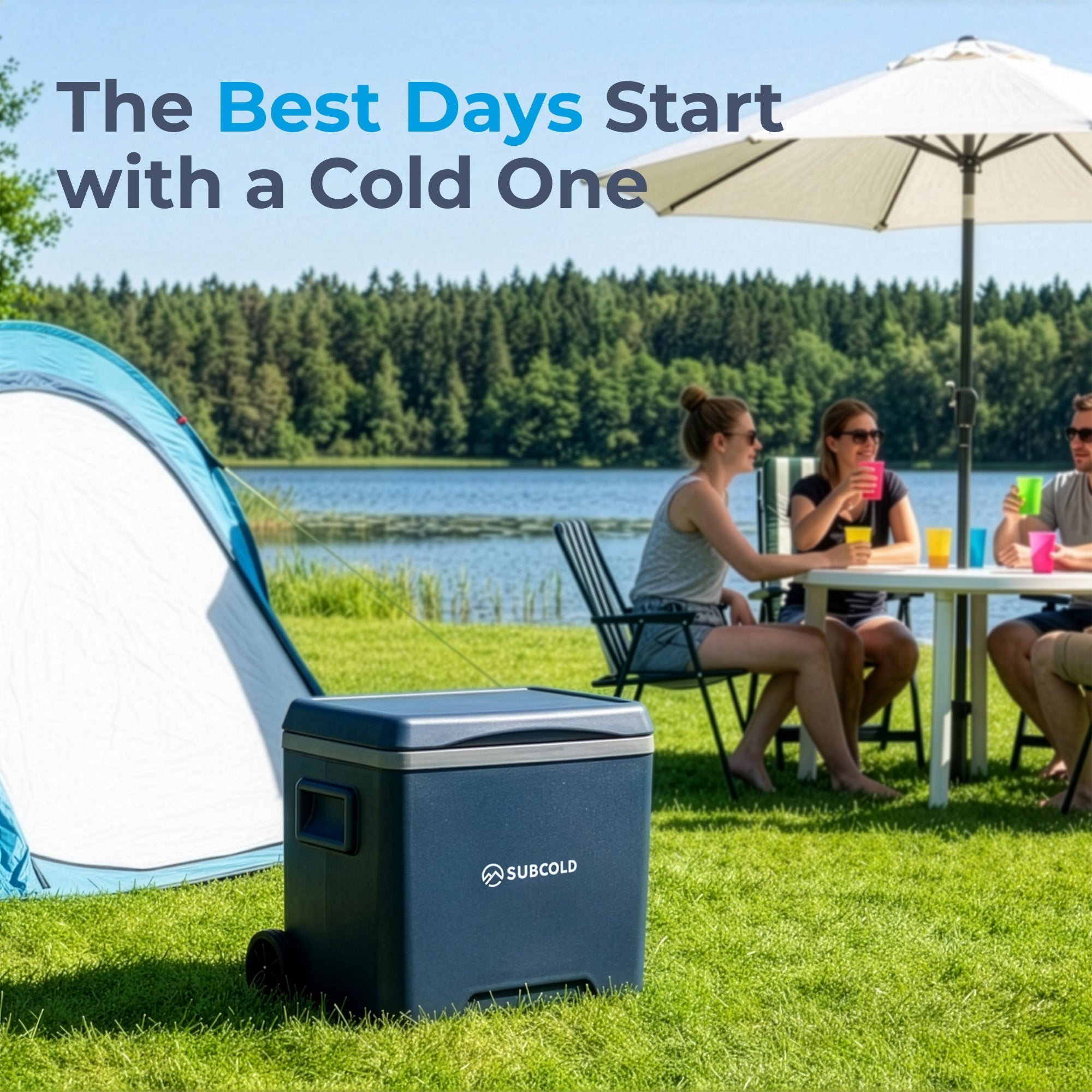 Dark blue subcold chilly30 cool box with silver trim and wheels on grass near tent portable cool box