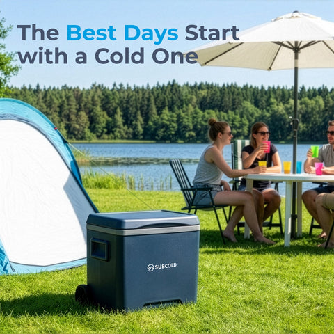Dark blue subcold chilly30 cool box with silver trim and wheels on grass near tent portable cool box