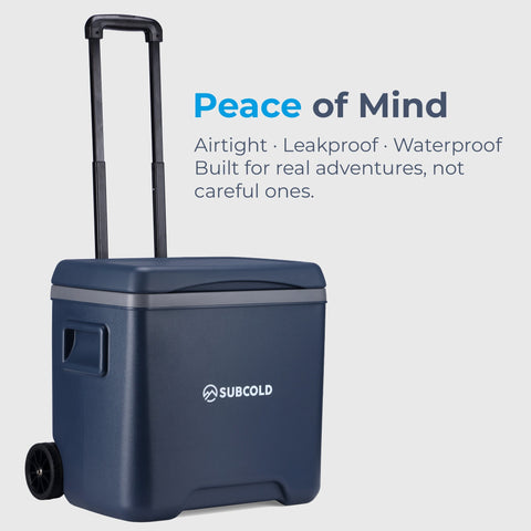 Navy blue subcold chilly30 portable cool box with black handle and wheels for easy transport