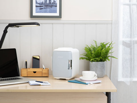 Light gray subcold classic 4l mini fridge with sleek modern design and silver handle mini cooler for small spaces