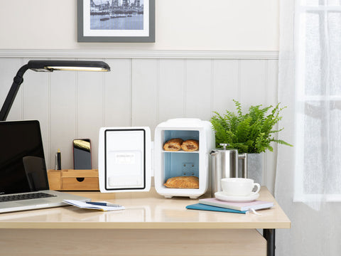 White subcold classic 4l mini fridge with blue interior and open door showing two loaves of bread inside