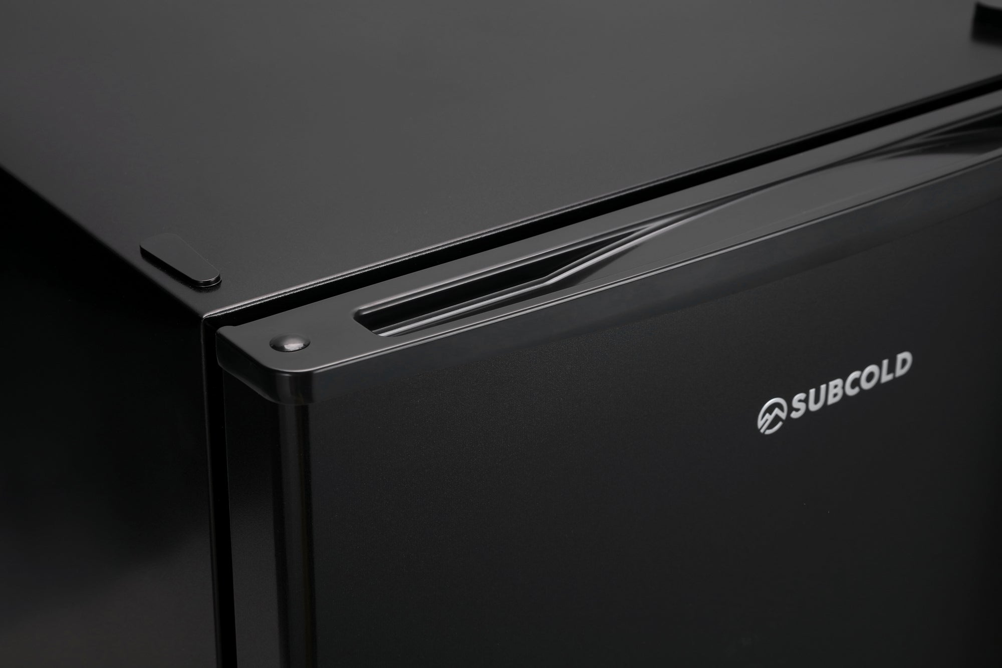 Black subcold eco35f mini freezer with sleek glossy finish and minimalist design perfect for small space use