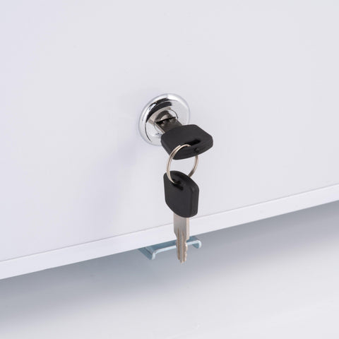 Black plastic keys with silver blades inserted into chrome keyhole on white subcold eco75 table top fridge cabinet