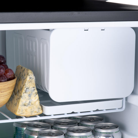 White rectangular freezer compartment with smooth rounded lid and vertical ridges on subcold eco75 table top fridge